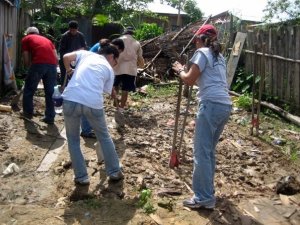Trash was buried into the mud floor. We did our best to dig it out, then we leveled the floor as best as we could.